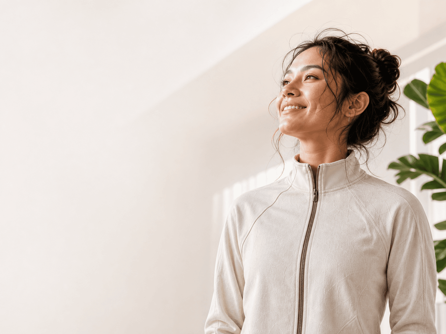 Woman smiling in a bright wellness space